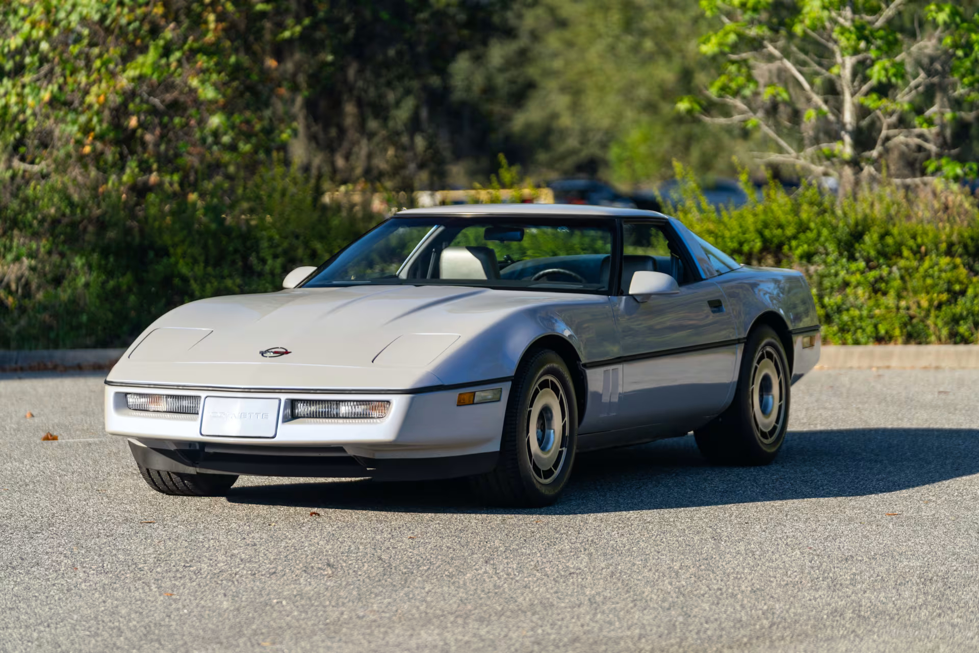 front-angled profile of a white 1984 Chevrolet Corvette.