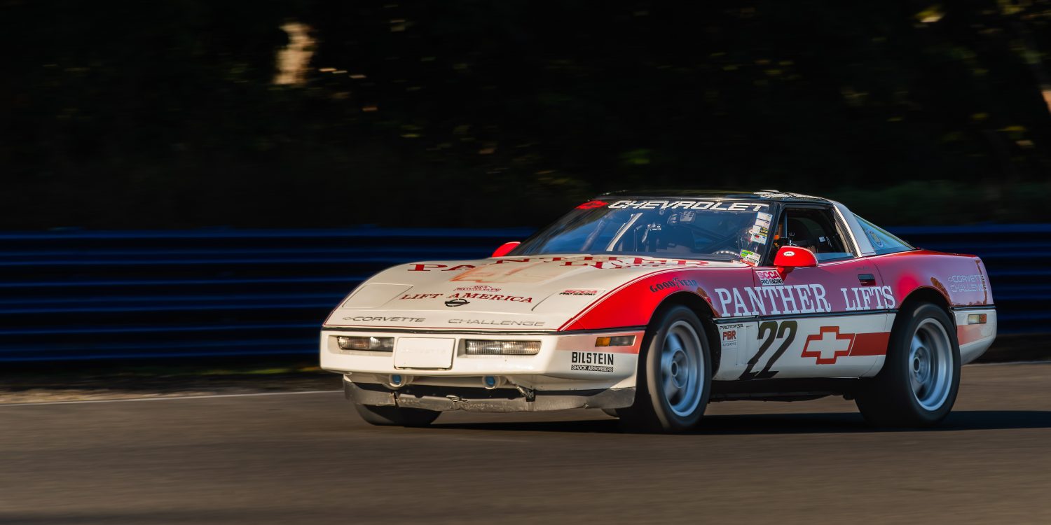 Three-quarter side view of a 1988 Chevrolet Corvette race car driven by Jake Angel