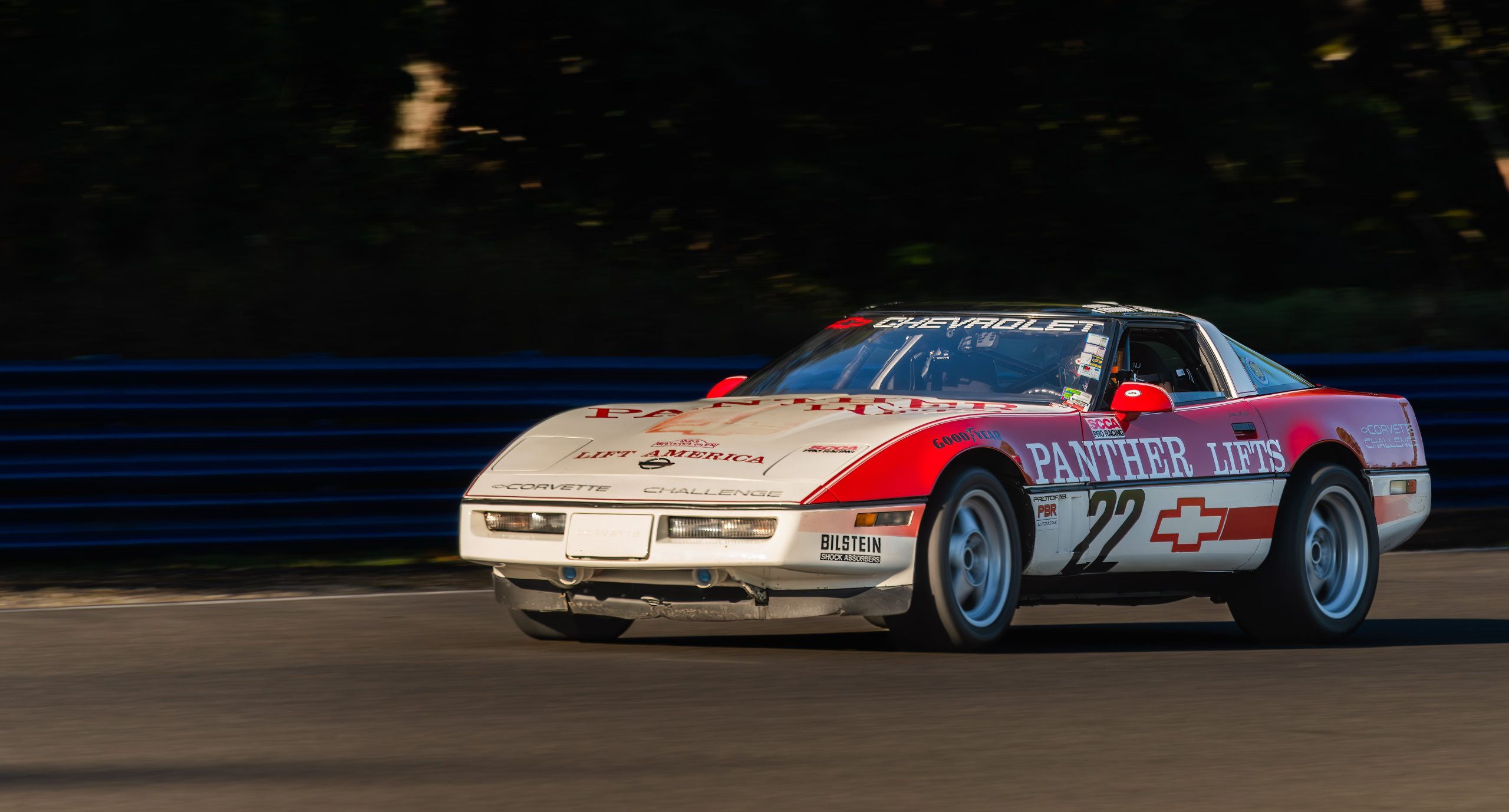 Three-quarter side view of a 1988 Chevrolet Corvette race car driven by Jake Angel