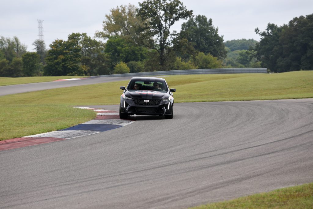 Despite experiencing some understeering and body roll, the Cadillac Blackwing is an incredibly capable "track car", which is all the more impressive given the level of comfort built into this car Preparing to take the 2024 Cadillac CT5-V Blackwing out on the NCM Motorsport Park racetrack for tour laps. (Image courtesy of Cole Carroll/NCM Motorsports Park.)