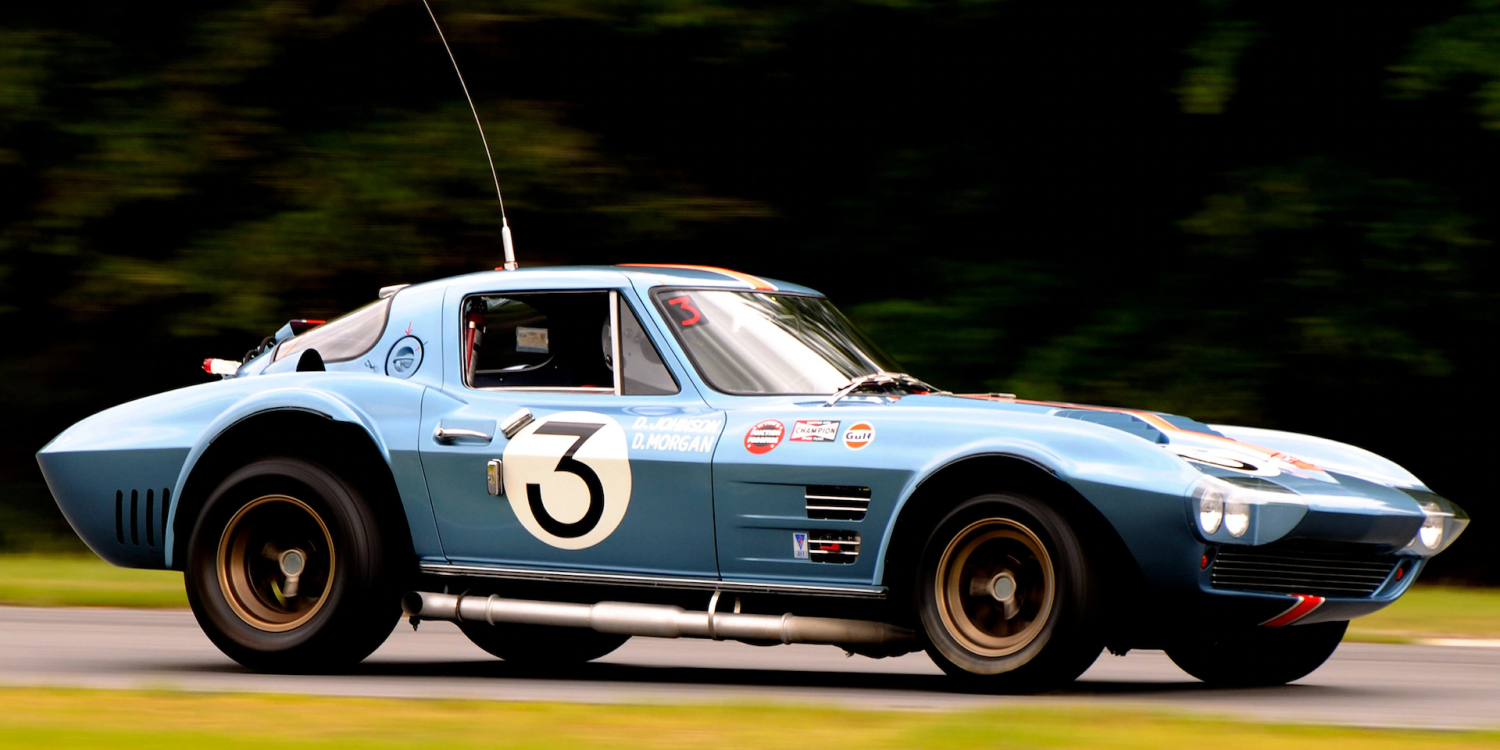 Side view of a 1963 Corvette Grand Sport at a racing track