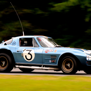 Side view of a 1963 Corvette Grand Sport at a racing track