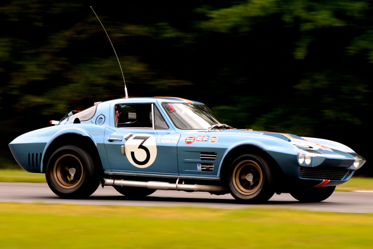 Side view of a 1963 Corvette Grand Sport at a racing track