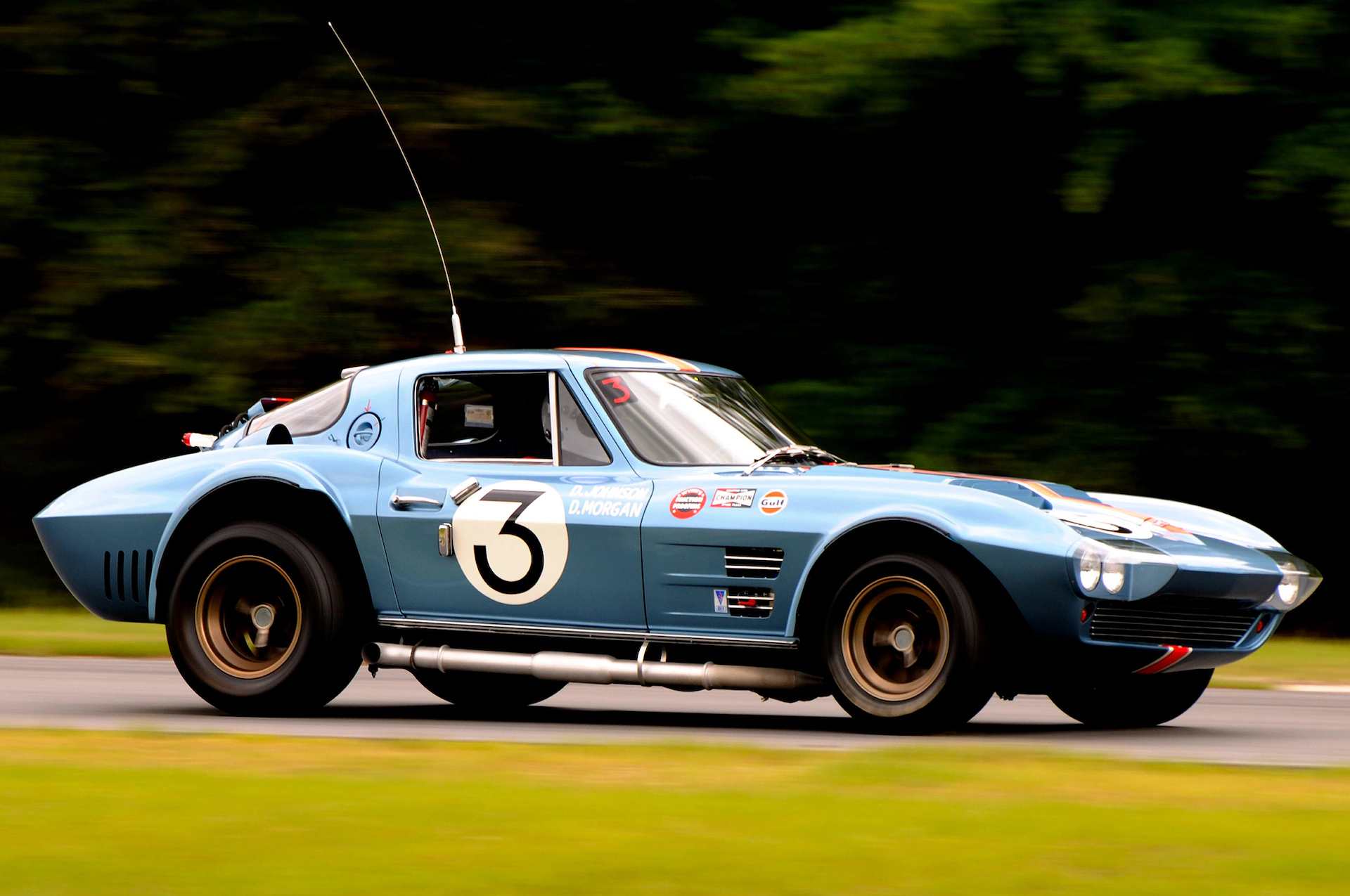 Side view of a 1963 Corvette Grand Sport at a racing track