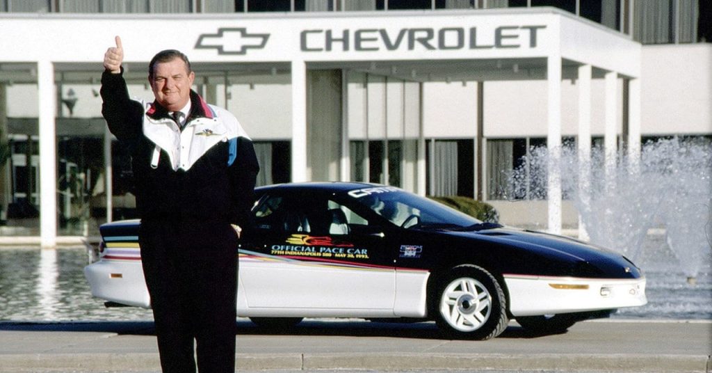 Jim Perkins, former Chevrolet General Manager and 1999 Inductee into the Corvette Hall of Fame, has been hailed by automotive historians the world over as the man who "saved the Corvette saga in its lowest hours." Jim, seen here in front of a 1993 Camaro Indy Pace Car, enthusiastically gives the camera a "thumbs up." This behavior was indicative of Jim Perkins, a man who felt enormous pride for the Chevrolet brand - so much so that he gave out tiny Chevy bowtie pins with the word "PROUD" beneath the bowtie. His belief in the brand, and his desire to do what was needed to save it, allowed Jim to bring the C5 Corvette back from the brink and help transform it into one of the most successful generations of Corvette ever. (Image courtesy of GM Media.)